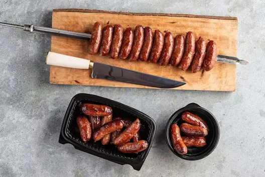 Gaucho knife and grilled meat preparation at Leblon Churrascaria