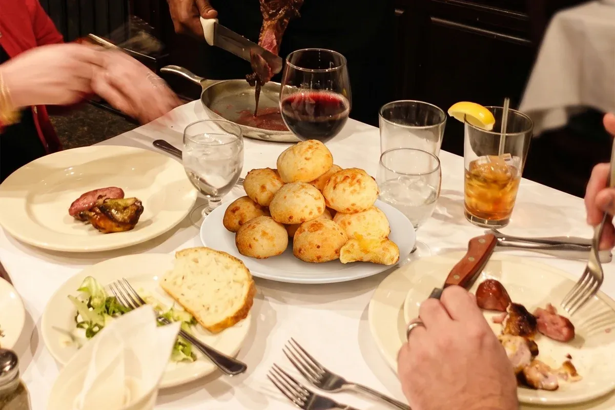 Pão de queijo cheese bread served tableside